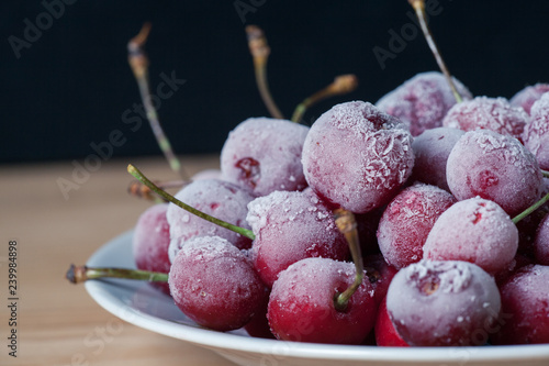 Frozen cherries on a plate.