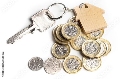 House key on key chain with UK money