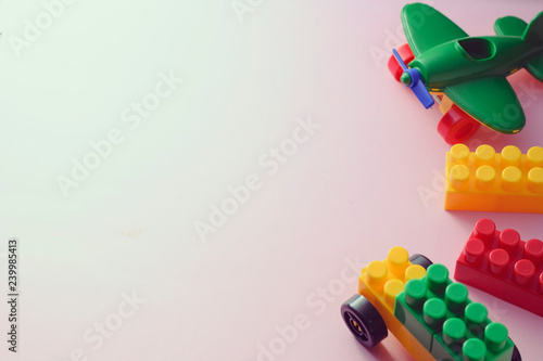 Border of colorful plastic kids toys
