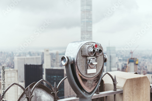 close up view of operated binoculars on observation deck in new york city, usa