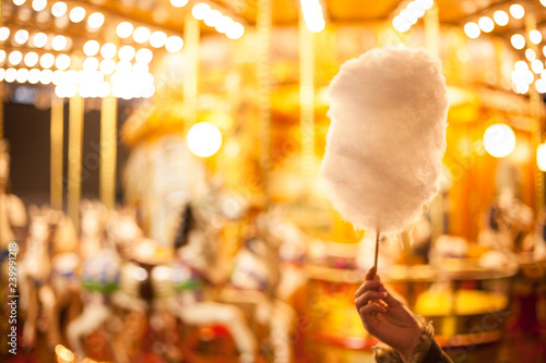 A cotton candy in front of an ancient German Horse Carousel built in 1896 in Navona Square, Rome, Italy photo