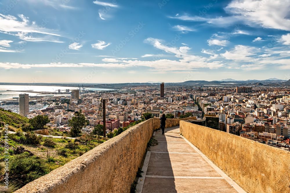 View of ramp connecting Santa Barbara castle with downtown Alicante; high angle view of the city and the Mediterranean sea.