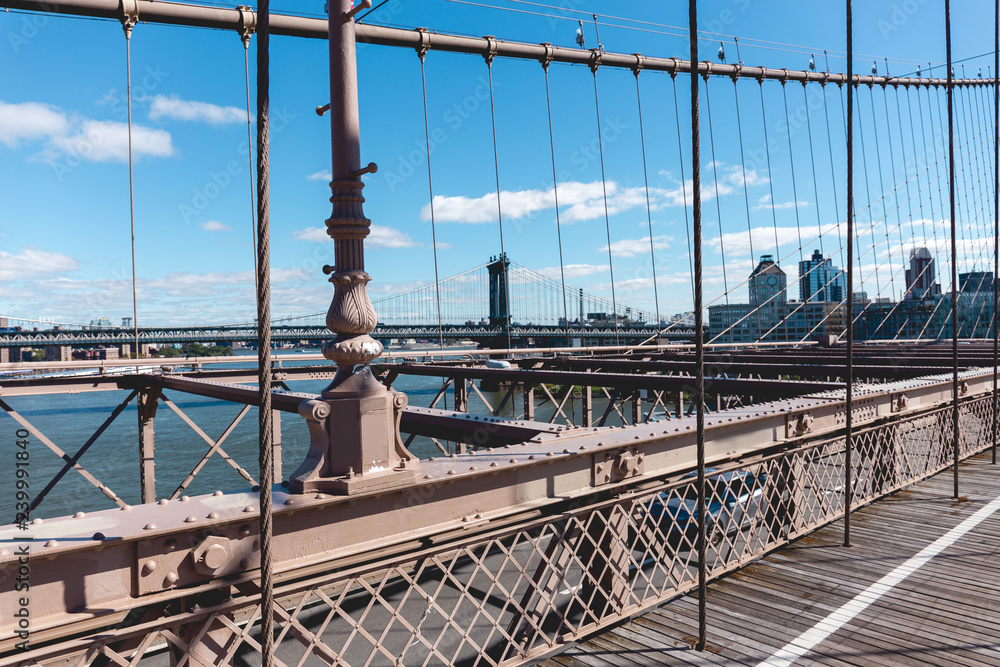 Fototapeta premium brooklyn bridge on blue sky and manhattan on background, new york, usa