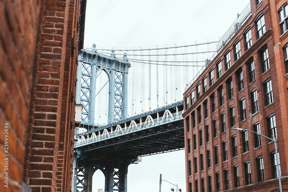 urban scene with buildings and brooklyn bridge in new york city, usa