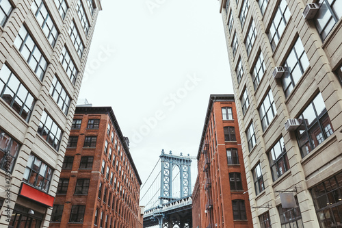 urban scene with buildings and brooklyn bridge in new york city  usa