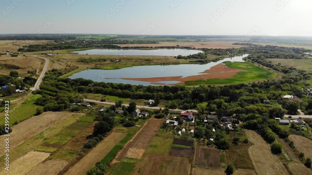 Natural landscape of central Russia with field, river and pond in fall. downward movement Natural landscape of central Russia with field, river and pond in fall. downward movement