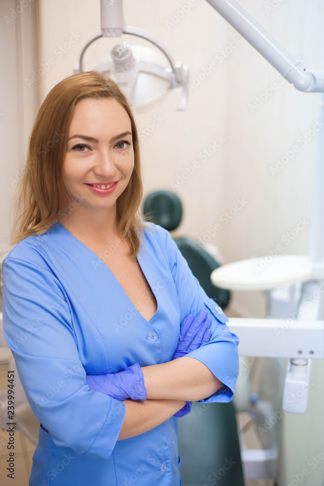 Portrait of modern dentist woman at work.