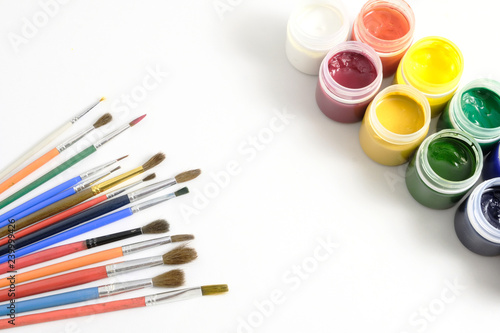 colorful paints and brushes