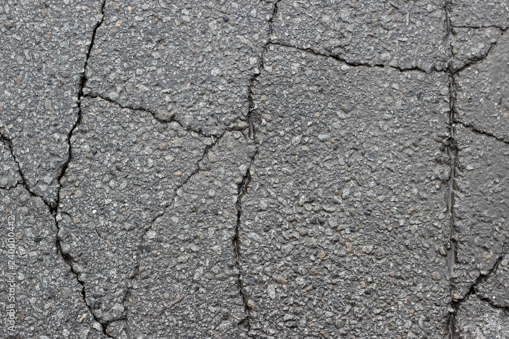 Obraz premium Asphalt wet crack fracture surface texture