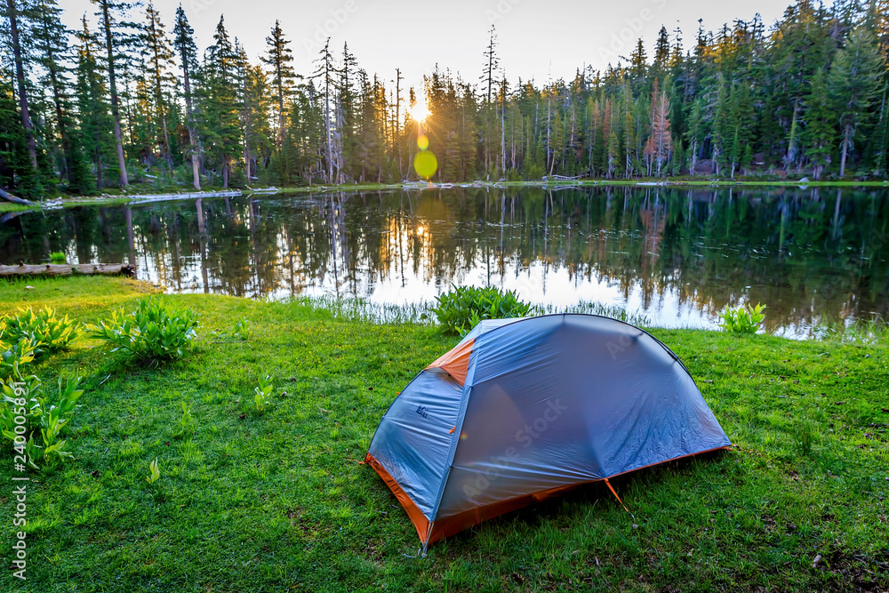 Tent in the Meadow by the Lake