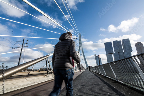 man walking on Erasmus Bridge © francescograssi