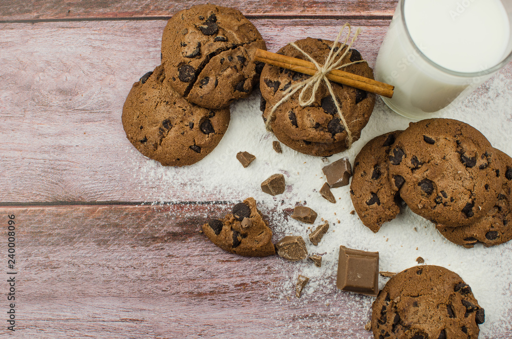 freshly baked chocolate chip cookies on rustic wooden table freshly baked chocolate chip cookies on rustic wooden table