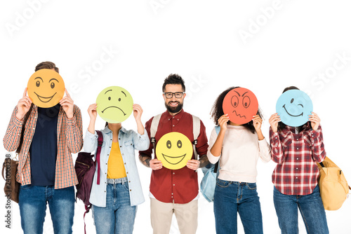 handsome man in glasses smiling near group of people showing emotions on cards isolated on white