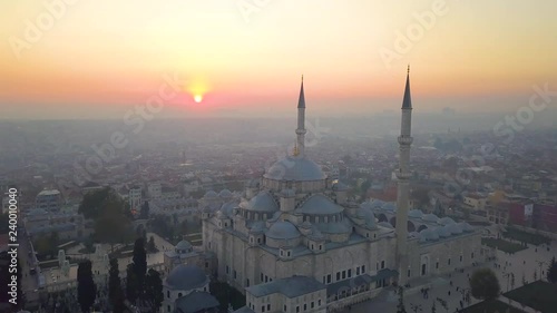 fatih mosque flying close and passing at sundown photo