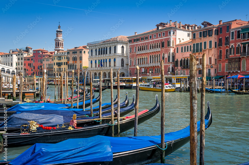 Fototapeta premium Old gondola boats and Venice channel view