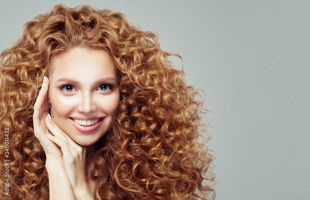 Happy redhead womanwith long curly hair. Emotion. Expressive facial expressions