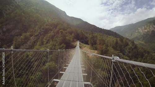 Suspension bridge in the mountains near the village of Perarollo di Cadore.