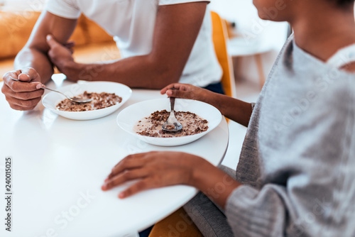 African american family eating healthy breakfast. Close-up. © bnenin