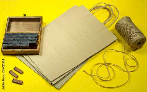 mini stamps and packaging bags for applying the brand on a yellow background
