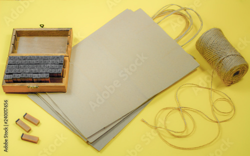 mini stamps and packaging bags for applying the brand on a yellow background