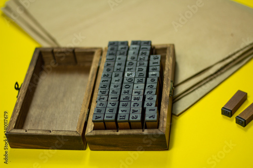 mini stamps and packaging bags for applying the brand on a yellow background