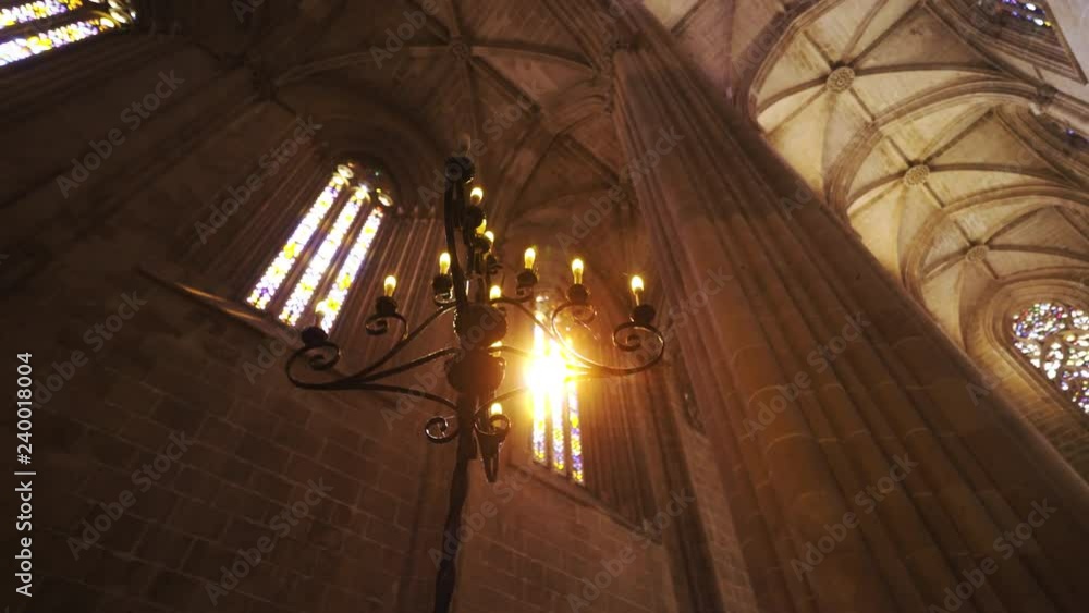 From above shot of beautiful candlestick standing inside spectacular aged cathedral in Portugal From above shot of beautiful candlestick standing inside spectacular aged cathedral in Portugal
