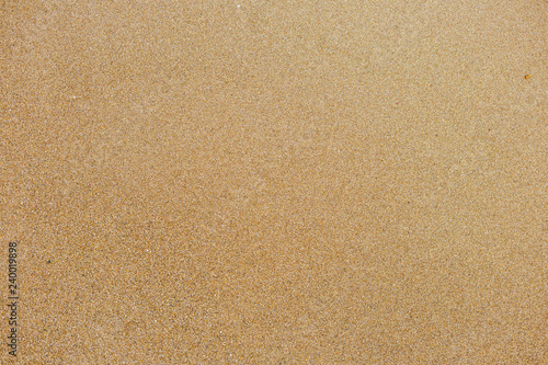 Top view of surface of clean golden sand at sea beach. Horizontal color photography.