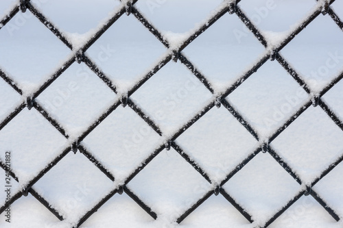 fence with snow closeup