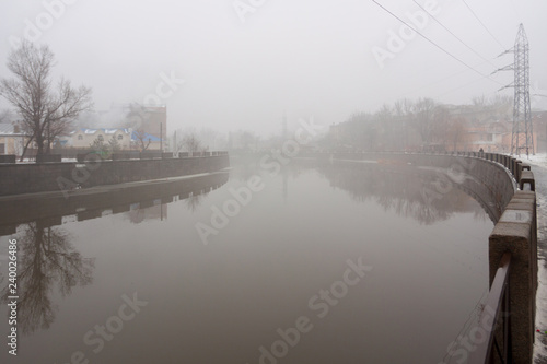Fog at the river and the embankment