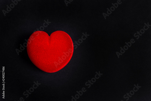 Red velvet jewelry box  heart shaped on black background