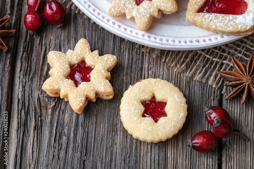 Linzer Christmas cookies on a wooden table