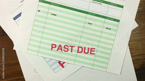 Debt. Stop motion animation of a pile of unpaid bills and accounts with a threat of legal action followed by a plea for help.