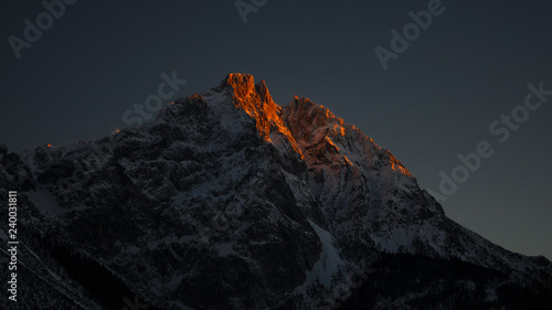 illuminated peak rocks of mountain peak at late evening in tirol © A2LE