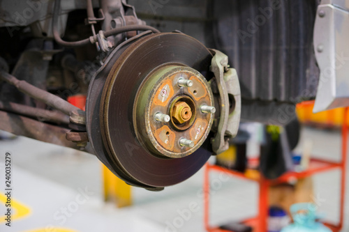 car brake part at garage,car brake disc without wheels closeup