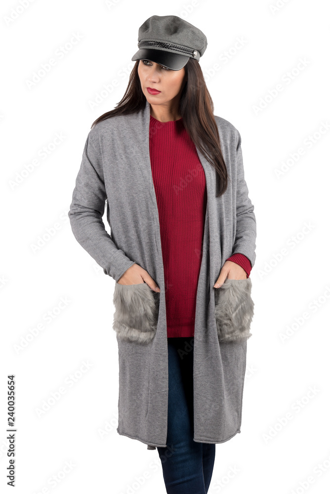 Female model posing with cardigan with gray leather pockets to match with felt cap in the same color Female model posing with cardigan with gray leather pockets to match with felt cap in the same color