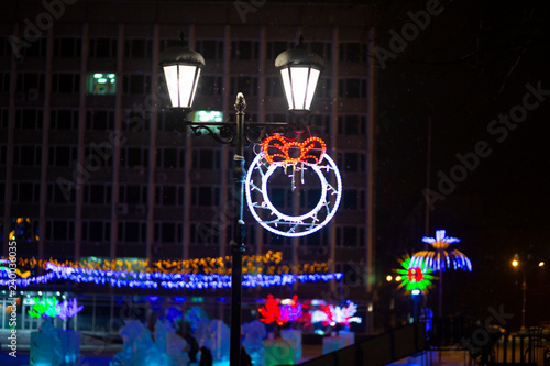 burning the night lamp on the street in winter