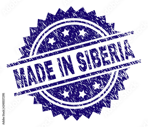 MADE IN SIBERIA stamp seal watermark with distress style. Blue vector rubber print of MADE IN SIBERIA text with corroded texture.