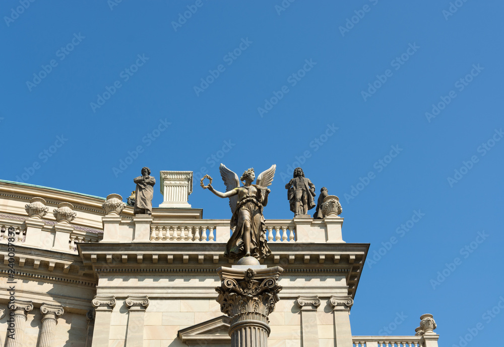 Angel statue column in front of Concert Hall Rudolfium, Prague, Czech Republic