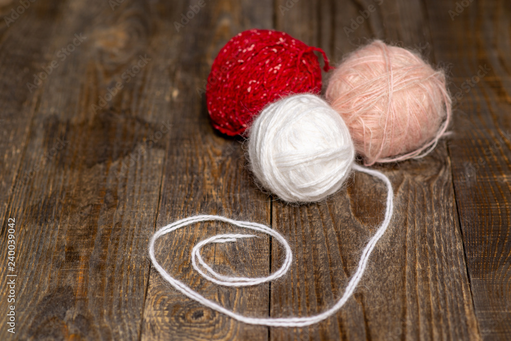 tangles of yarn on wooden background