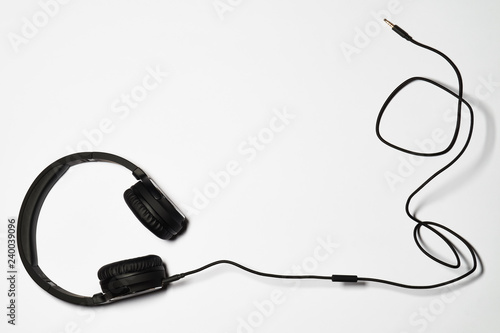 Black audio headphones isolated on white background