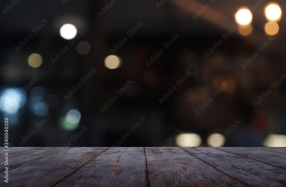 Empty dark wooden table in front of abstract blurred background of cafe and coffee shop interior. can be used for display or montage your products - Image.