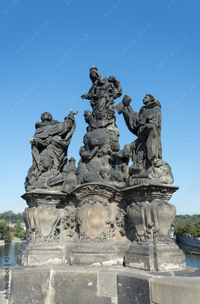 Sculpture at Charles Bridge on Vltava river in Prague, Czech Republi