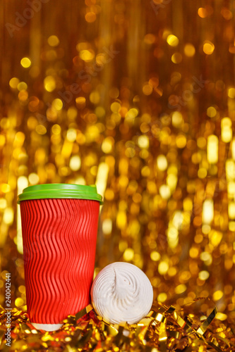 Coffee in red cup with marshmallow and Christmas golden metafan photo