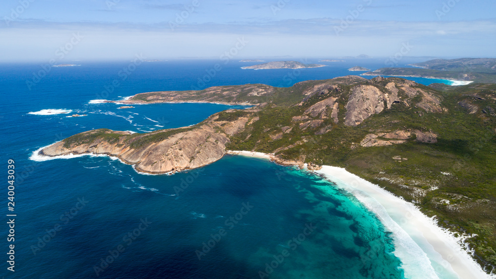 Aerial view of picturesque coastline scenery of Hellfire Bay, colorful cliffs and rocks, white sand beach and crystal clear water - Cape Le Grand, Esperance, Western Australia from above