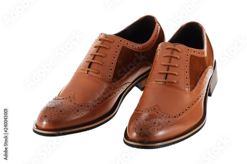 Pair of brown leather men's shoes brogues on a white background with clipping path
