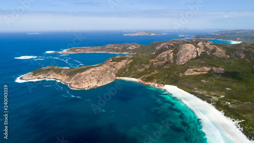 Aerial view of picturesque coastline scenery of Hellfire Bay, colorful cliffs and rocks, white sand beach and crystal clear water - Cape Le Grand, Esperance, Western Australia from above © unicusx