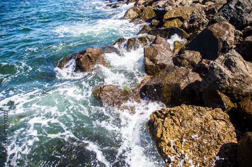 image of stones in the sea with waves, beautiful background