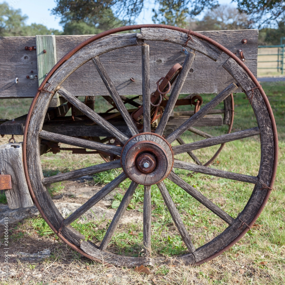Vintage weathered farm wagon wheel.