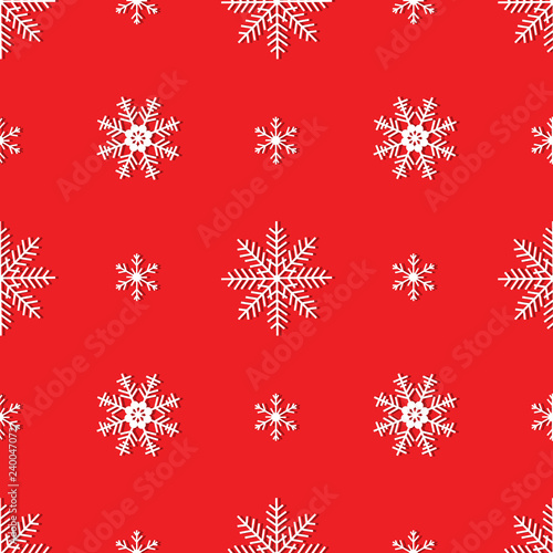 Vector seamless pattern of white snowflakes on a red background.