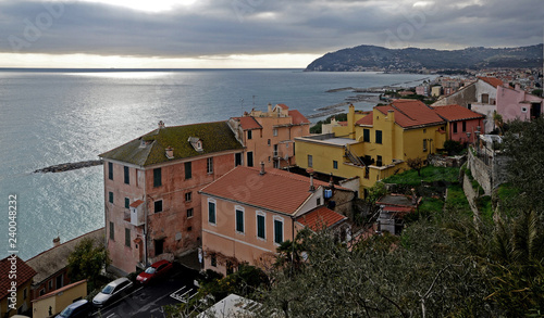 Liguria, Italy, landscape of Cervo town in winter. Mountain and mediterranean sea in the background